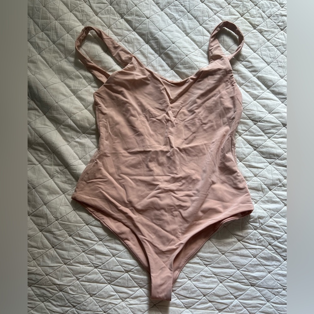 Slightly faded, coral one piece
